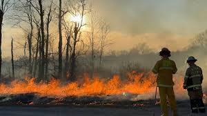 Boone County Fire Protection District firefighters work to control a natural cover fire during continuing dry conditions in 2025