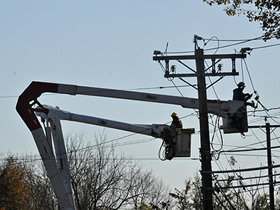 image of men working on powerlines