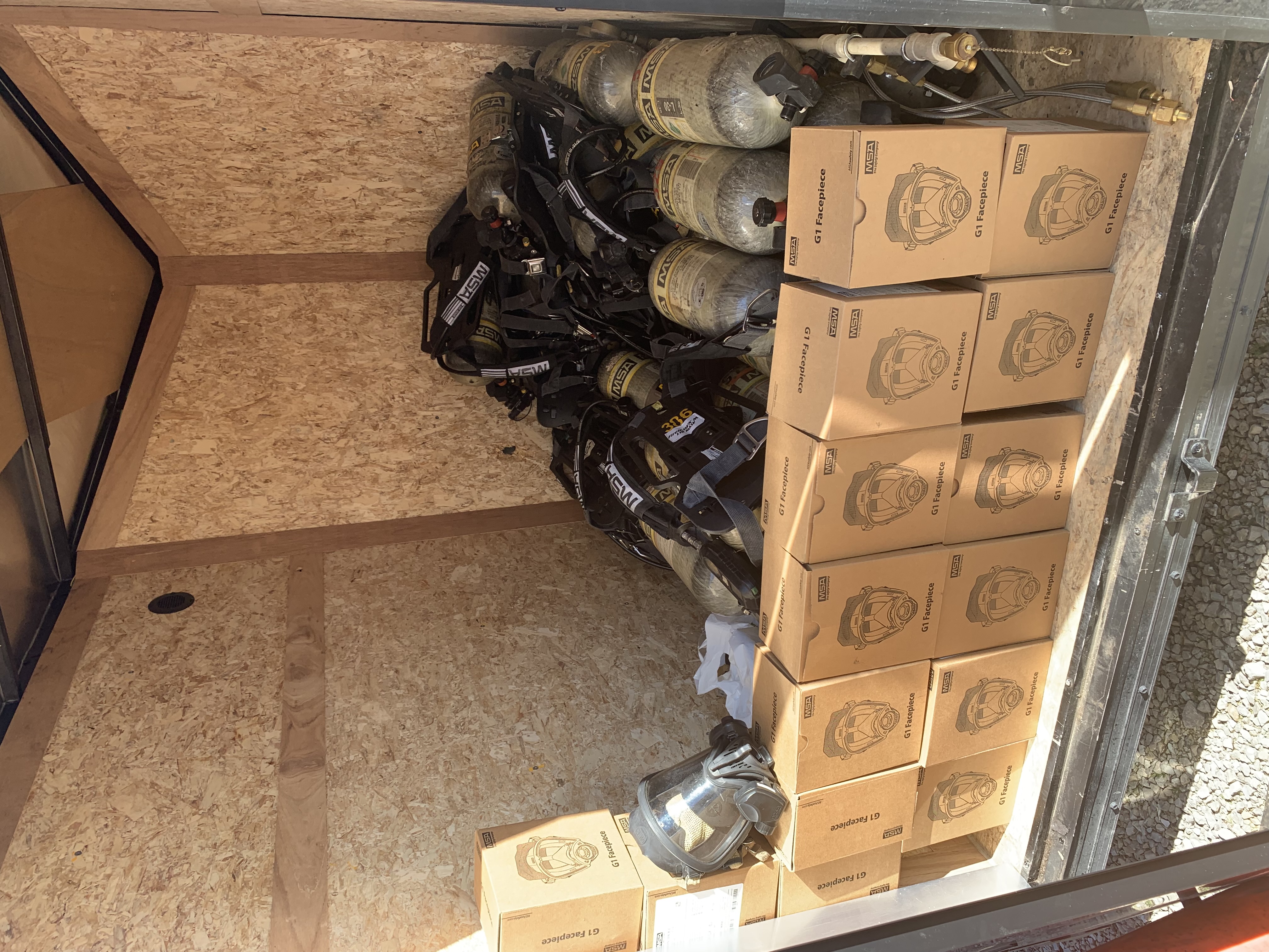 picture of a group of scba packs, bottles and masks